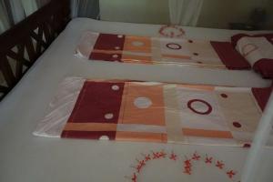Katil atau katil-katil dalam bilik di Mallis Guesthouse