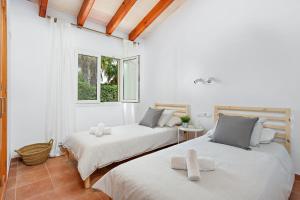 Postel nebo postele na pokoji v ubytování Villa Menorca Sirio by Mauter Villas