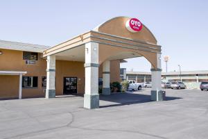 a building with a stop sign on top of it at OYO Hotel Eloy Casa Grande near I-10 in Eloy