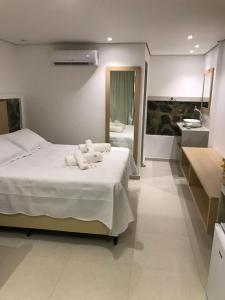 Кровать или кровати в номере Suites Amma Noronha