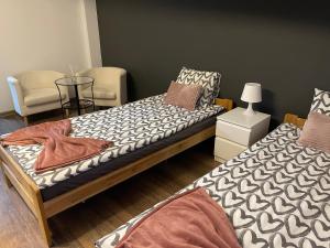 Giường trong phòng chung tại Apartament Rodzinny Ostrowiec Św