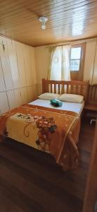 a bedroom with two beds in a boat at Sitio rio ferro in São Bonifácio