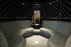 two chairs in a room with a toilet in it at Grupotel Los Príncipes & Spa in Playa de Muro