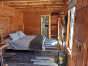 Postel nebo postele na pokoji v ubytování HelChiloé Cabañas