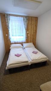 Postel nebo postele na pokoji v ubytování Penzion Na Sluníčku