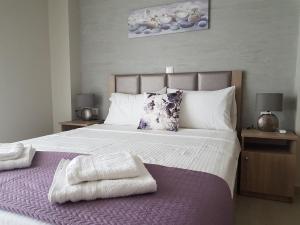 Posteľ alebo postele v izbe v ubytovaní Villas Mamas Beach