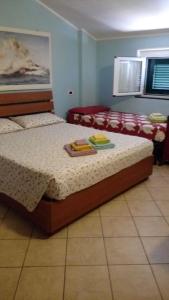 Posteľ alebo postele v izbe v ubytovaní Iris Casa Vacanze