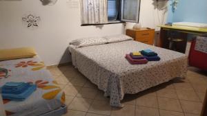 Posteľ alebo postele v izbe v ubytovaní Iris Casa Vacanze