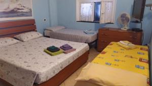 Posteľ alebo postele v izbe v ubytovaní Iris Casa Vacanze