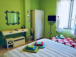 Posteľ alebo postele v izbe v ubytovaní Iris Casa Vacanze