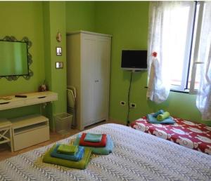 Posteľ alebo postele v izbe v ubytovaní Iris Casa Vacanze