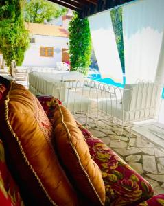 a couch sitting on top of a patio at La Casita Inn Bustamante in Bustamante