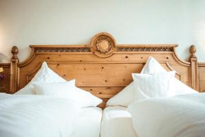 Postel nebo postele na pokoji v ubytování Hotel Limmerhof