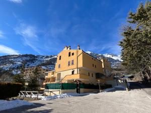 three people standing on top of a building in the snow at Campo Felice Suite in Rocca di Cambio