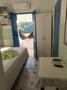 Een bed of bedden in een kamer bij Pousada da Lurdinha