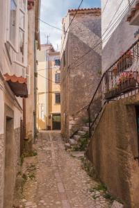 an alley in an alley between two buildings at Rustica in Vrbnik