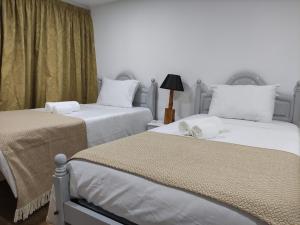 Postelja oz. postelje v sobi nastanitve Casa do Lago da Quinta de Esteves