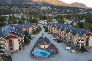 an aerial view of an apartment complex with a parking lot at Heavenly Mountain Hideaway, Pool, Hot Tub in Radium Hot Springs