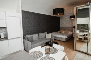 a living room with a couch and a table at AH Poštová in Košice