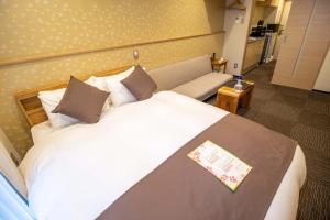Letto o letti in una camera di Stay SAKURA Kyoto Shijo Karasuma