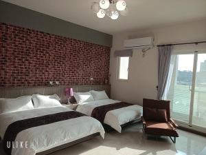 Ein Bett oder Betten in einem Zimmer der Unterkunft Happy Life B&B
