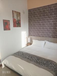 Ein Bett oder Betten in einem Zimmer der Unterkunft Happy Life B&B