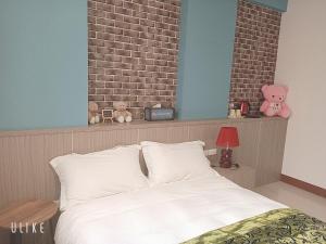 Ein Bett oder Betten in einem Zimmer der Unterkunft Happy Life B&B