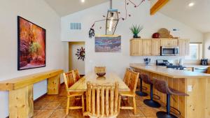 a kitchen and dining room with a table and chairs at Moab Adventure #V3 in Moab