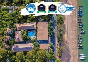 an aerial view of a resort with a pool and a building at Aonang Princeville Villa Resort & Spa - GHA WellHotel-Halal Certified, Krabi, Thailand in Ao Nang Beach