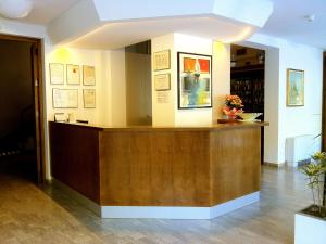 a lobby with a reception desk in a building at Hotel Bermuda in Marina di Ravenna