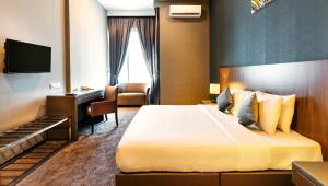 Postel nebo postele na pokoji v ubytování Le'venue Hotel