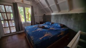 Voodi või voodid majutusasutuse Saho Coffee & Rooms toas