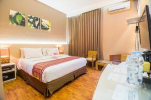 Postel nebo postele na pokoji v ubytování Oxville Hotel