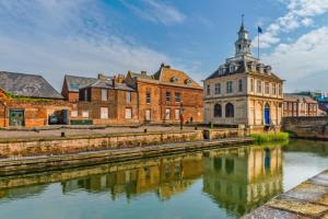 a group of buildings next to a river at Private Double Room With New En-suite Shower Room in Kings Lynn