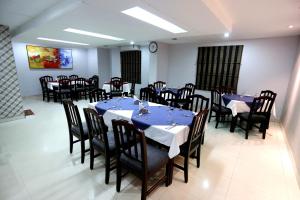 A restaurant or other place to eat at Orchid Business Hotel
