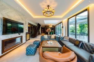 a living room with a couch and a fireplace at Z Villa Tam Đảo - Venuestay in Vĩnh Phúc