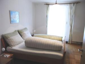 a couch sitting in a living room with a window at Zwettltalblick in Zwettl Stadt