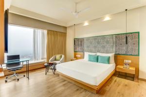Letto o letti in una camera di Lemon Tree Premier, Bhubaneswar