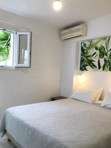 Letto o letti in una camera di Matina Hotel