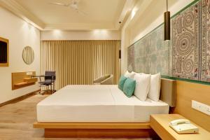 Letto o letti in una camera di Lemon Tree Premier, Bhubaneswar