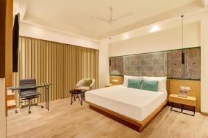 Letto o letti in una camera di Lemon Tree Premier, Bhubaneswar