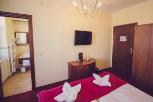 Postel nebo postele na pokoji v ubytování Hotel Arena City + 37 fotografií
