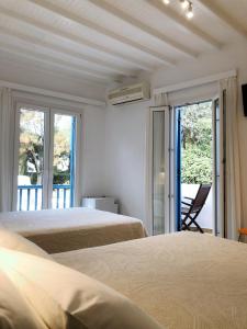 Postel nebo postele na pokoji v ubytování Matina Hotel + 37 fotografií