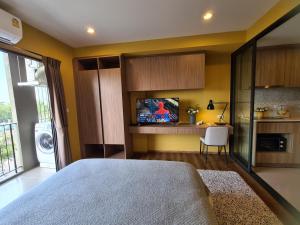 a bedroom with a bed and a tv in it at Huahin mountain view room near the beach in Hua Hin +12 photos