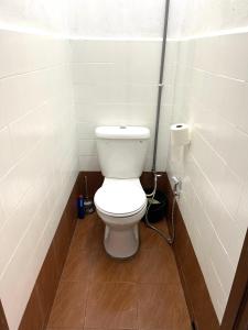 a bathroom with a white toilet in a stall at Entire Cozy Home 16 • 3 bedroom @ Alma Bukit Mertajam in Bukit Mertajam +32 photos