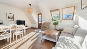 Televízia a/alebo spoločenská miestnosť v ubytovaní Apartamenty Sun & Snow Lipki Park Zakopane