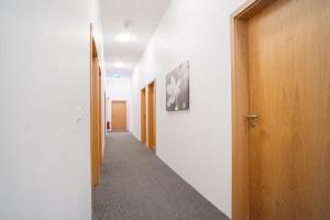 a corridor of an office building with a hallway at Guesthouse Pavi in Reykjavík