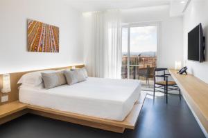 Postel nebo postele na pokoji v ubytování Felix Hotels - Hotel Felix Olbia