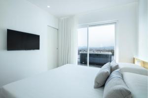 Postel nebo postele na pokoji v ubytování Felix Hotels - Hotel Felix Olbia