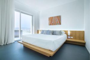 Postel nebo postele na pokoji v ubytování Felix Hotels - Hotel Felix Olbia